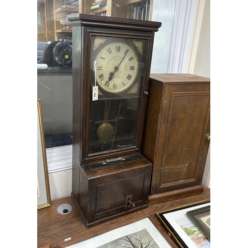 206 - A Gledhill-Brook Time Recorder clocking-in machine, on associated cupboard, combined height 183cm... 