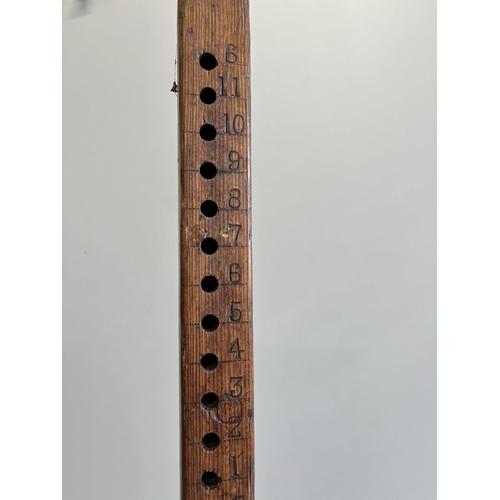 211 - A wooden height measure, height 184cm