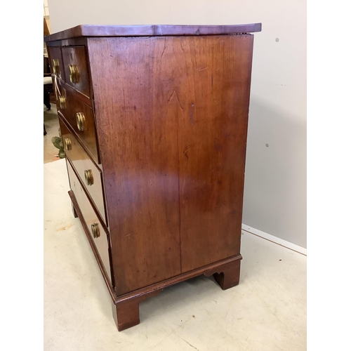 24 - A Georgian mahogany straight front chest of two short and three long drawers, brass ring handles on ... 