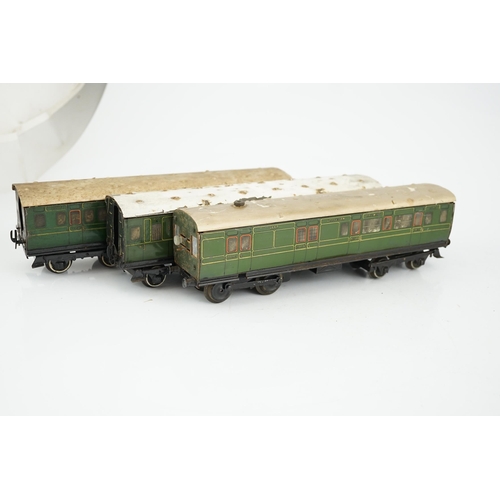 269 - Six Hornby 0 gauge tinplate No.2 coaches in Southern Railway livery, one coach adapted to a driving ... 