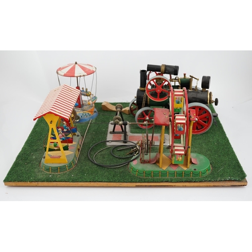 287 - A Wilesco live steam fairground diorama, comprising a D430 pellet fired traction engine, powering a ... 