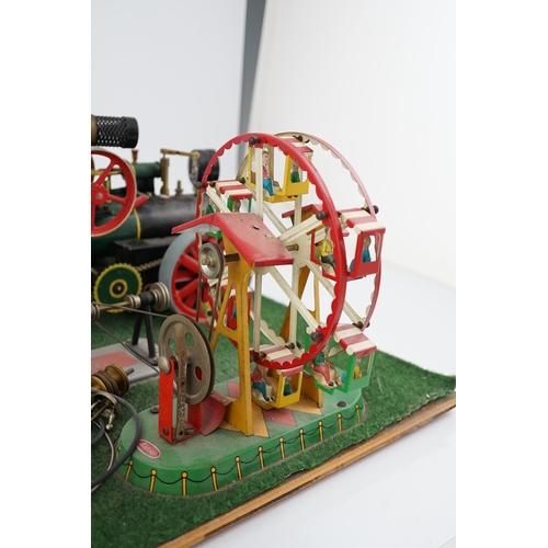 287 - A Wilesco live steam fairground diorama, comprising a D430 pellet fired traction engine, powering a ... 