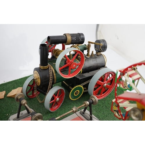 287 - A Wilesco live steam fairground diorama, comprising a D430 pellet fired traction engine, powering a ... 