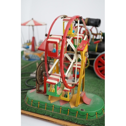 287 - A Wilesco live steam fairground diorama, comprising a D430 pellet fired traction engine, powering a ... 