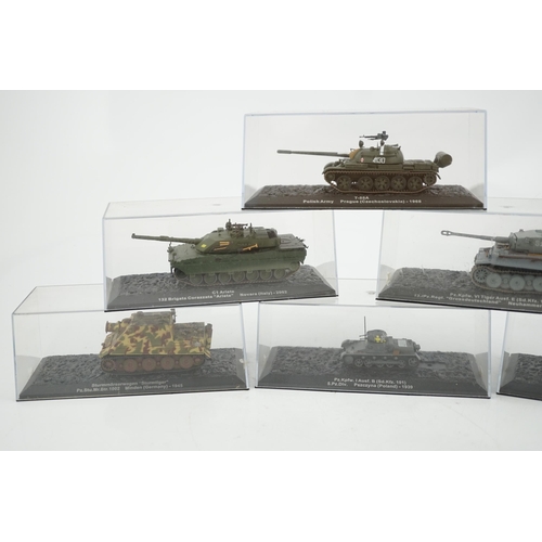 299 - Sixty-eight magazine issue military vehicles in plastic display cases, including; tanks, armoured ca... 