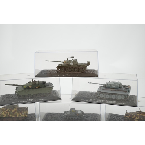 299 - Sixty-eight magazine issue military vehicles in plastic display cases, including; tanks, armoured ca... 