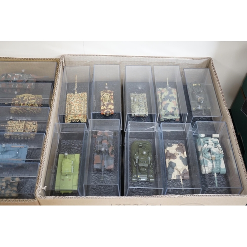 299 - Sixty-eight magazine issue military vehicles in plastic display cases, including; tanks, armoured ca... 