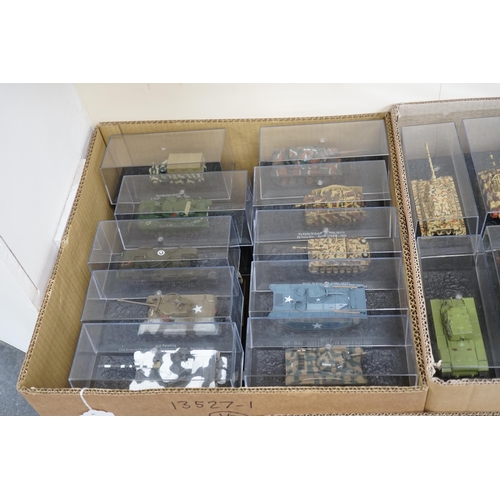 299 - Sixty-eight magazine issue military vehicles in plastic display cases, including; tanks, armoured ca... 