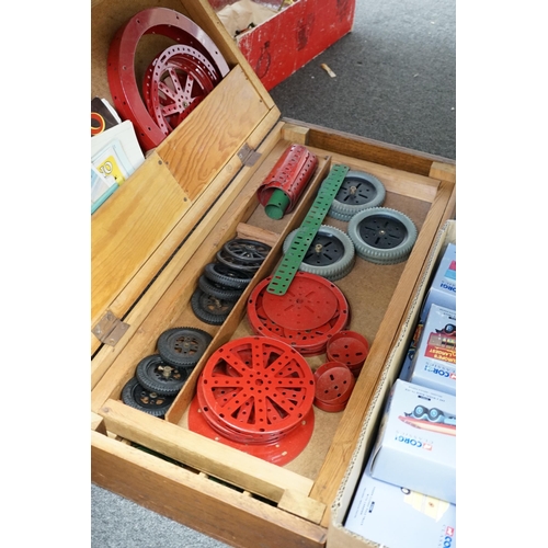 303 - A collection of early Meccano components, mainly from the red and green period, comprising of some o... 