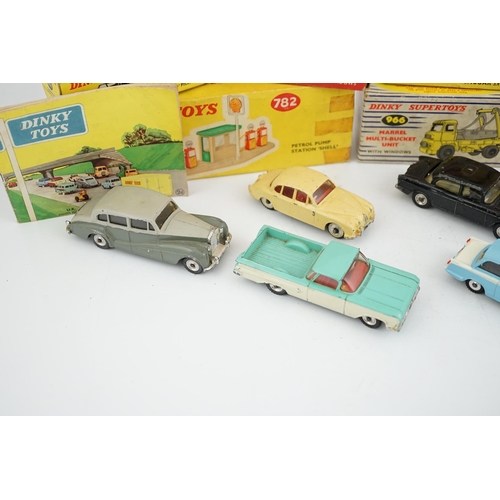 319 - Eleven boxed Dinky Toys; a Triumph Herald (189), a Plymouth U.S.A. Taxi (265), a Chevrolet El Camin... 