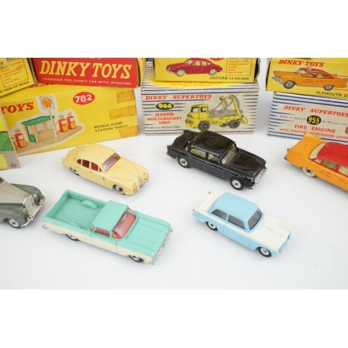 319 - Eleven boxed Dinky Toys; a Triumph Herald (189), a Plymouth U.S.A. Taxi (265), a Chevrolet El Camin... 