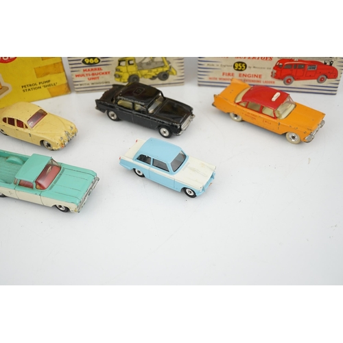 319 - Eleven boxed Dinky Toys; a Triumph Herald (189), a Plymouth U.S.A. Taxi (265), a Chevrolet El Camin... 