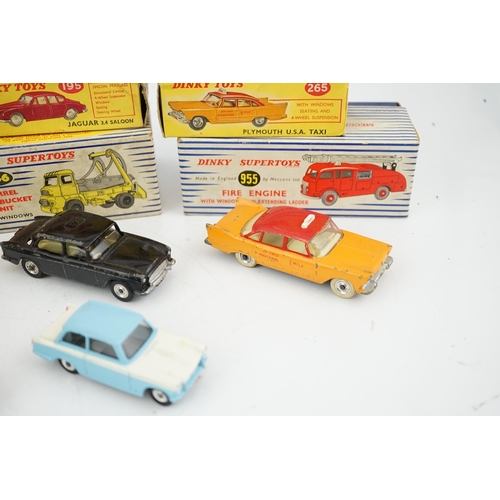 319 - Eleven boxed Dinky Toys; a Triumph Herald (189), a Plymouth U.S.A. Taxi (265), a Chevrolet El Camin... 