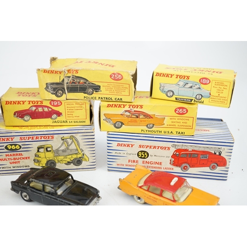 319 - Eleven boxed Dinky Toys; a Triumph Herald (189), a Plymouth U.S.A. Taxi (265), a Chevrolet El Camin... 