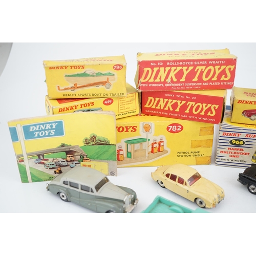 319 - Eleven boxed Dinky Toys; a Triumph Herald (189), a Plymouth U.S.A. Taxi (265), a Chevrolet El Camin... 