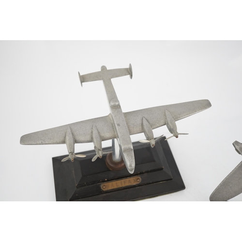 330 - Two cast aluminium military aircraft models mounted on stepped wooden bases; a Halifax bomber, wings... 