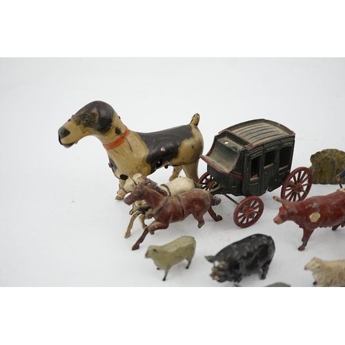 331 - A collection of Britains, etc. lead farm animals and accessories, including the farmer, farmers wif... 