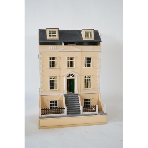 336 - A large modern Georgian style dolls house and extensive contents, with eight fully decorated rooms o... 