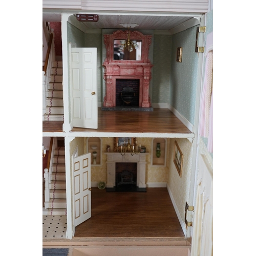 336 - A large modern Georgian style dolls house and extensive contents, with eight fully decorated rooms o... 