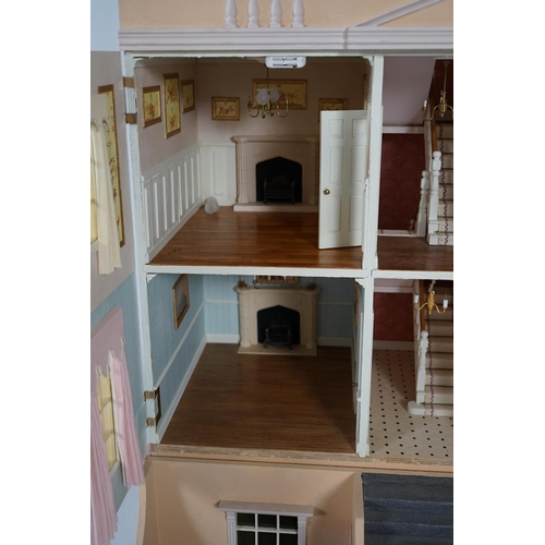 336 - A large modern Georgian style dolls house and extensive contents, with eight fully decorated rooms o... 