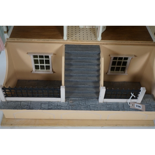 336 - A large modern Georgian style dolls house and extensive contents, with eight fully decorated rooms o... 