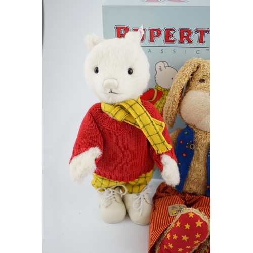 338 - Four Steiff toys including Boxer dog and Rupert Bear