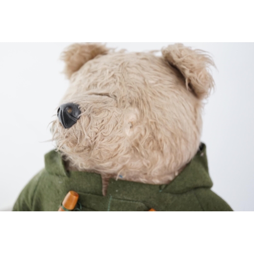 339 - An early Paddington bear, green jacket, missing hat, and a similar Paddington with Dunlop boots, red... 