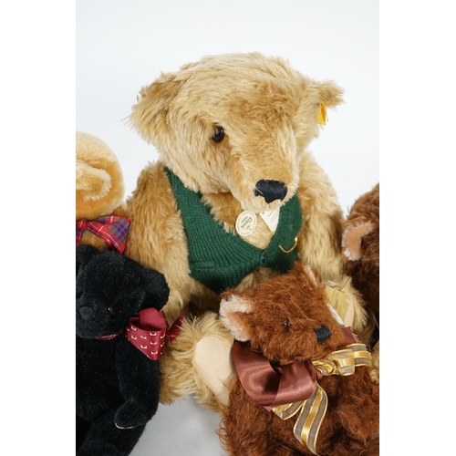 345 - A large 1906 Steiff orange label, two Merrythought John Lewis bears, a black Merrythought bear, an a... 