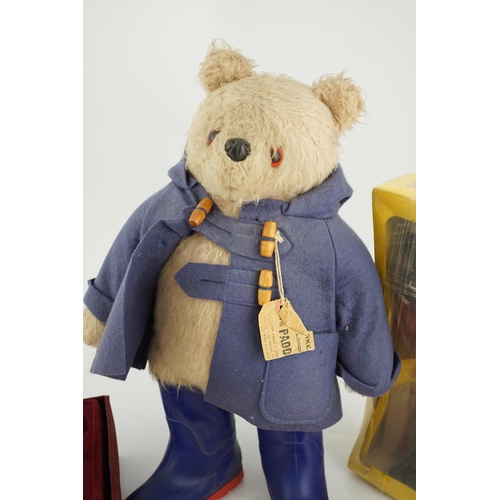 346 - An early Paddington bear, blue jacket, missing hat, a Steiff Ltd. edition lilac bear in box, and a p... 