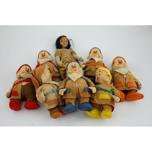 349 - A set of Merrythought Snow White and the Seven Dwarves, Snow White with Merrythought label to the so... 