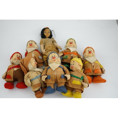 349 - A set of Merrythought Snow White and the Seven Dwarves, Snow White with Merrythought label to the so... 