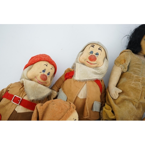 349 - A set of Merrythought Snow White and the Seven Dwarves, Snow White with Merrythought label to the so... 