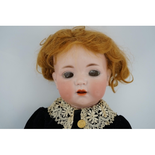 353 - A K&R Kammer & Reinhart /S & H bisque 121 head doll on toddler body, with vintage shoes and socks, 4... 