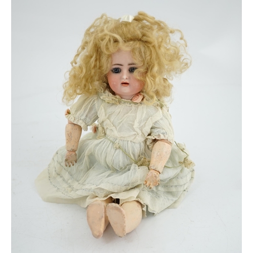 356 - A Kammer & Reinhart / S & H bisque head doll, pierced ears, vintage clothes, one finger missing, sli... 