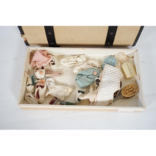 357 - A doll's trunk with assorted vintage clothes, shoes and doll's accessories