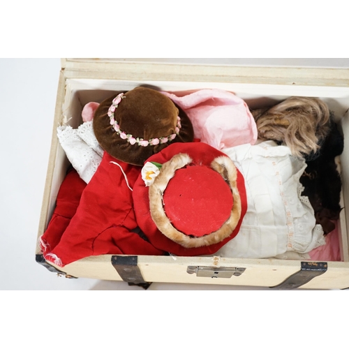 357 - A doll's trunk with assorted vintage clothes, shoes and doll's accessories