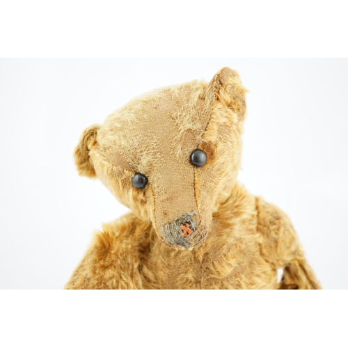 358 - A cinnamon Steiff bear  c.1908, with button paw pads, stuffing missing in arms, hair loss to head, m... 