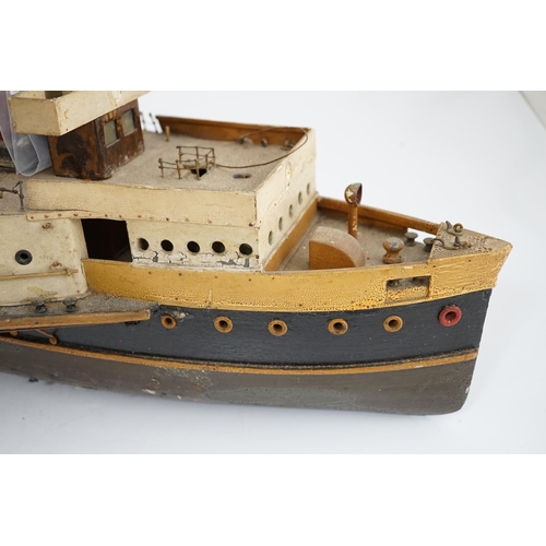 365 - A wooden model of a paddle steamer, with a well detailed deck and with some age to the model, howeve... 