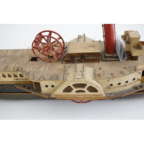 365 - A wooden model of a paddle steamer, with a well detailed deck and with some age to the model, howeve... 