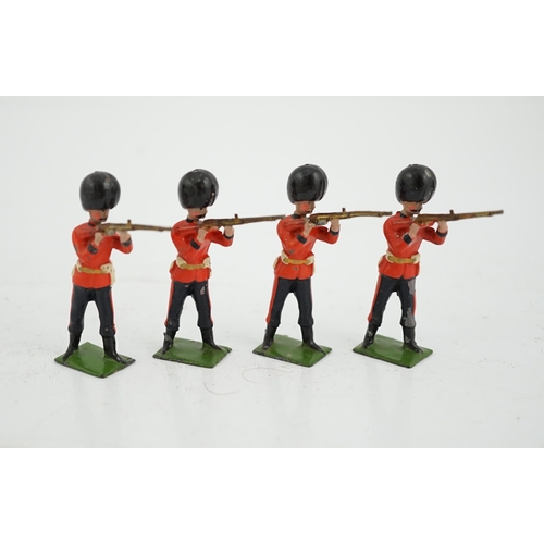 370 - Thirty-five early twentieth century Britains lead infantry soldiers; twenty Grenadier guards in busb... 