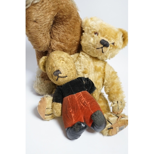 378 - A Chad Valley teddy bear, 34cm high, a smaller bear in velvet clothes and a Merrythought horse... 