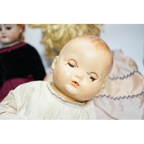 379 - Three dolls; a German Bisque shoulder head doll with sleeping eyes with jointed kid leather body, 46... 