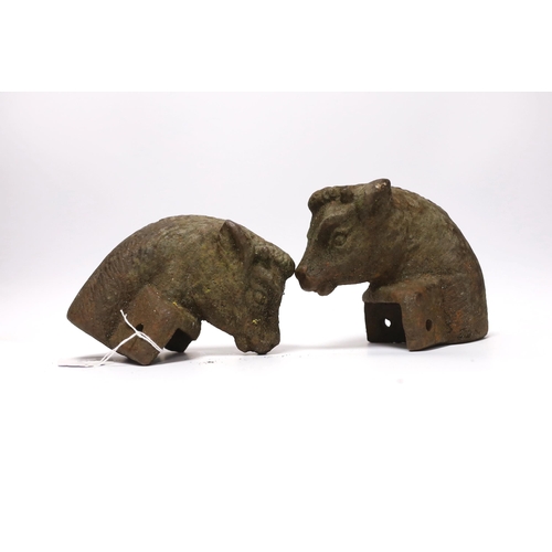 416 - A pair of cast iron bull's head post finials, 13cm