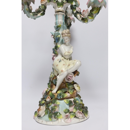 427 - A 19th century Sitzendorf floral encrusted four light figural candelabra, 50cm