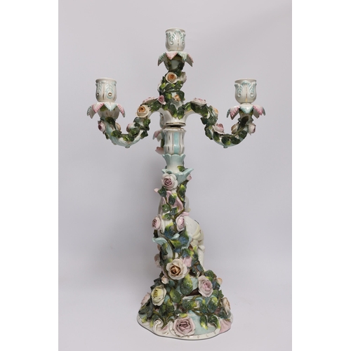 427 - A 19th century Sitzendorf floral encrusted four light figural candelabra, 50cm