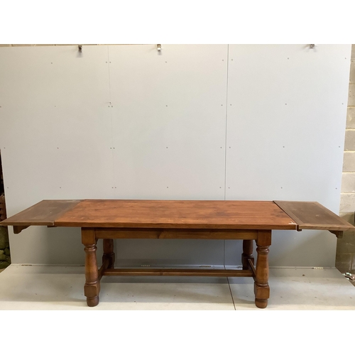 43 - An 18th century style rectangular oak refectory dining table, (extending leaves added later), width ... 