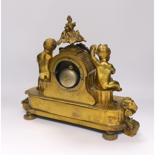 430 - A late 19th century French ormolu mantel clock surmounted with cherubs, 31cm