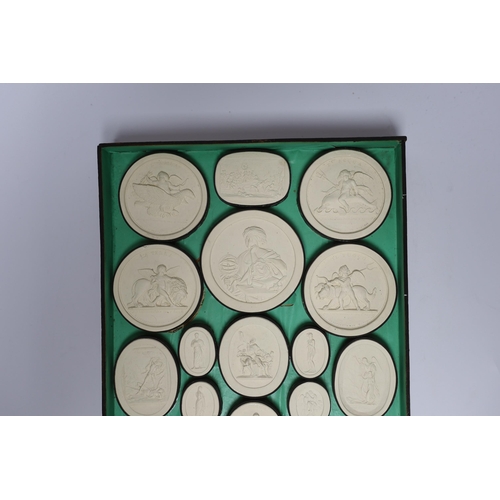 443 - A cased set of thirty two Italian Grand Tour plaster roundels after intaglios of various subjects... 