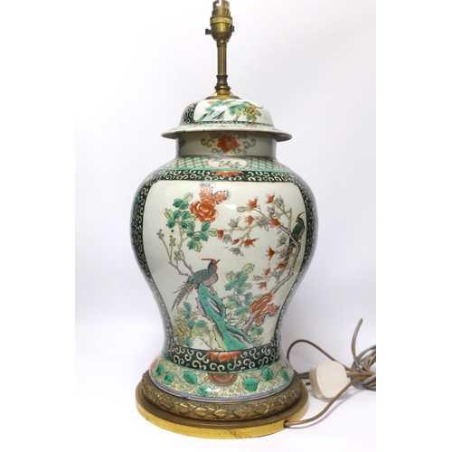 444 - A Chinese famille verte porcelain baluster vase and cover, 19th century, decorated with birds amongs... 