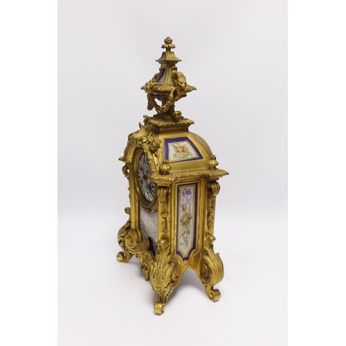 474 - A Sevres style ormolu clock, Miller & Sons with two similar gilt spelter urns, pendulum no key, 44cm... 